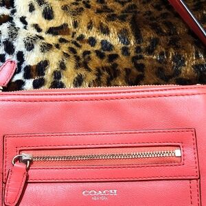 Coach crossbody in Salmon color.